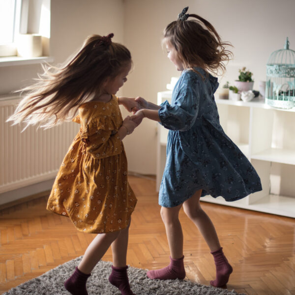 It's a joy to have a real friend in life. Two little girls playing at home.